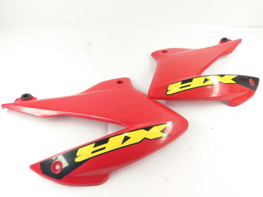 Honda XR 125 L JD19 [2005] - Panneau latéral droit et gauche avec fissure